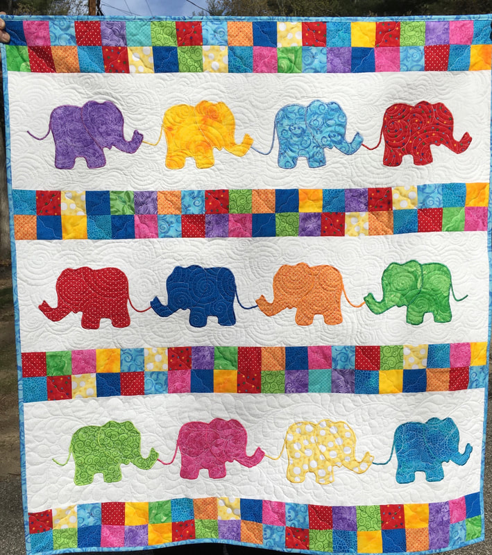 Colorful Elephant Baby Quilt from http://www.HomeSewnByCarolyn.com