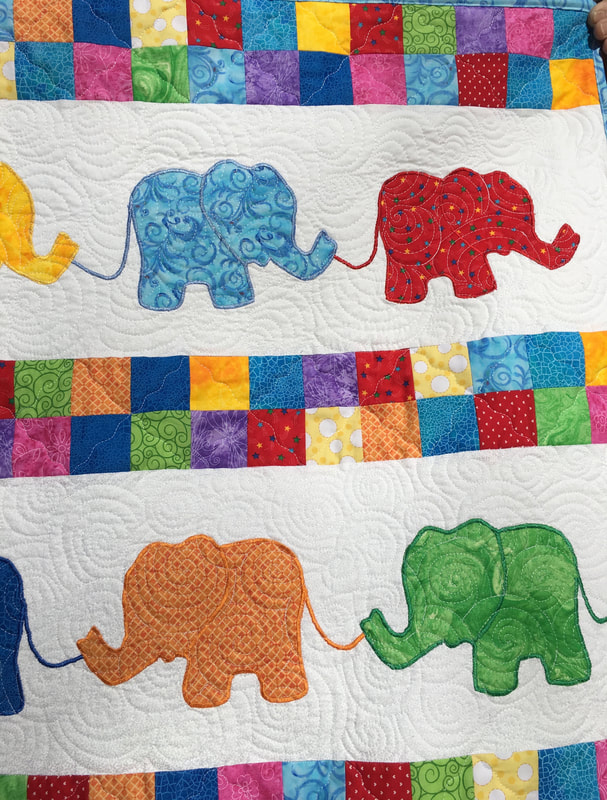 Elephant Baby Quilt makes a great baby shower gift, good for a boy or girl from http://www.HomeSewnByCarolyn.com