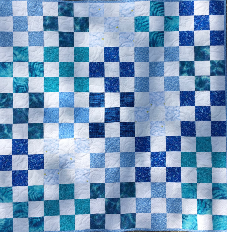 Blue and White Nine Patch Baby Quilt