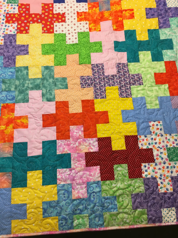 Colorful Puzzle Baby Quilt for sale from http://www.HomeSewnByCarolyn.com