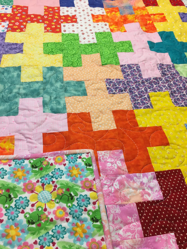 Puzzle Baby Quilt by http://www.HomeSewnByCarolyn.com