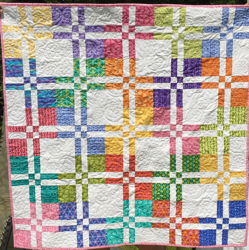 Disappearing Four Patch Baby Quilt for sale from http://www.HomeSewnByCarolyn.com