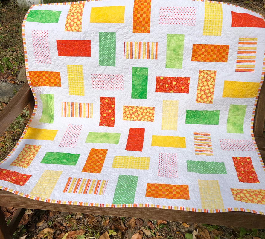 Sunshine Baby Quilt for  sale from http://www.HomeSewnByCarolyn.com/baby-quilts.html