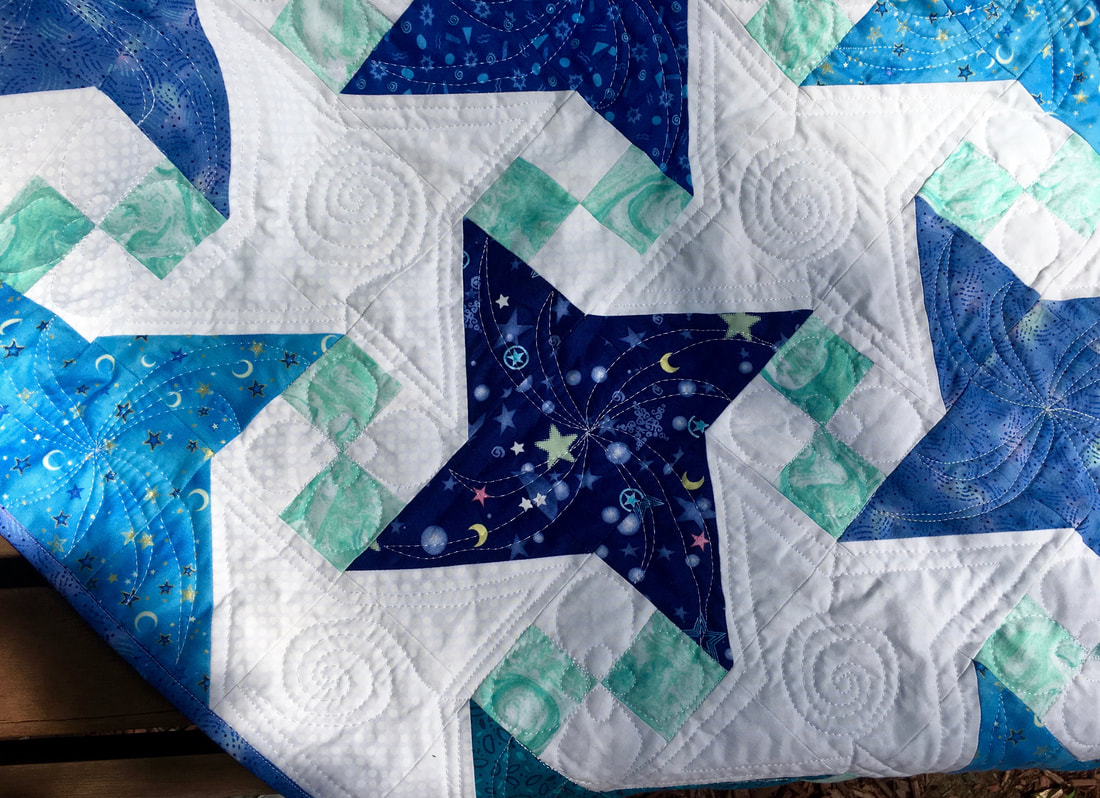 Milky Way quilt block with free motion quilting from http://www.HomeSEwnByCarolyn.com