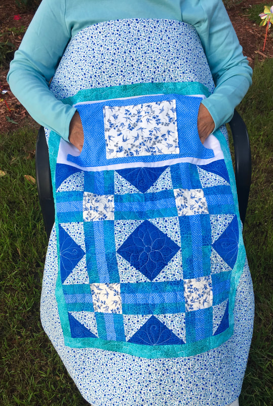 Beautiful Blue Lovie Lap Quilt with Pockets for sale from http://www.HomeSewnByCarolyn.com