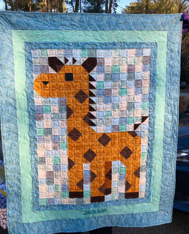 Giraffe Baby Quilt from http://www.HomeSewnByCarolyn.com/baby-quilt.html