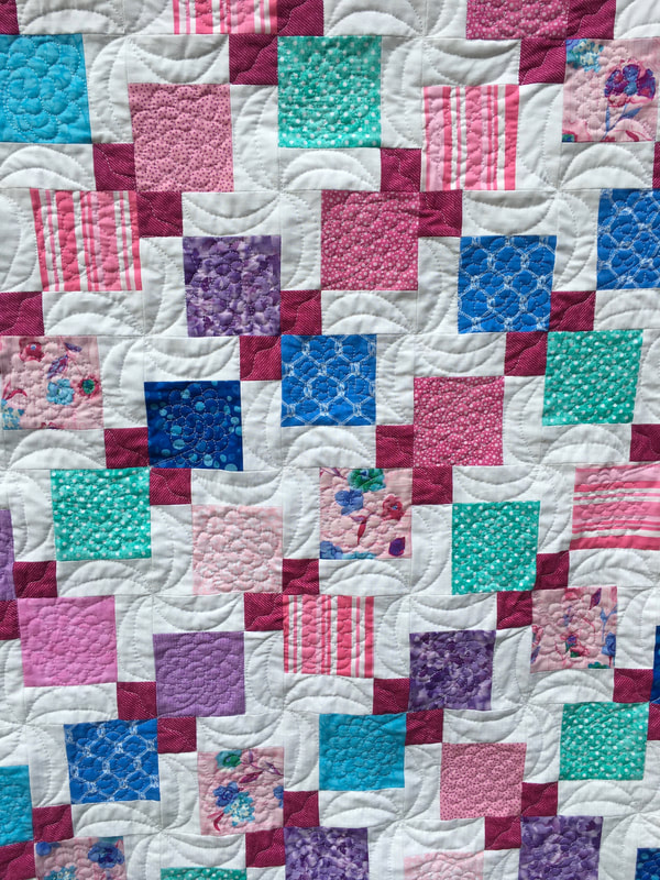 Disappearing Four Patch Baby Quilt from http://www.HomeSewnByCarolyn.com 