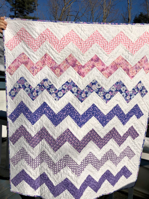 Pink and Purple Chevron Baby Quilt for sale from http://www.HomeSewnByCarolyn.com/baby-quilts.html