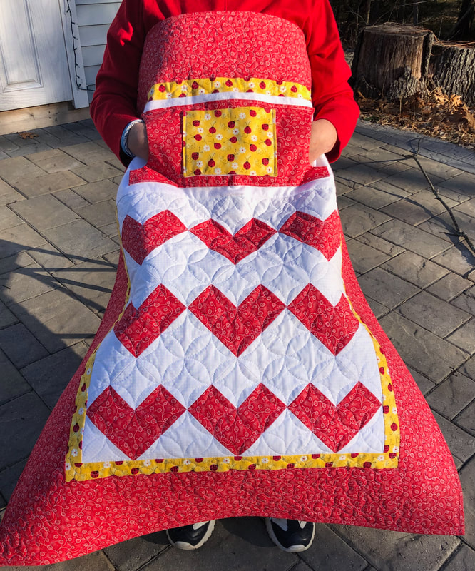 Hearts and Lady Bugs Lovie Lap Quilt with Pockets for sale.