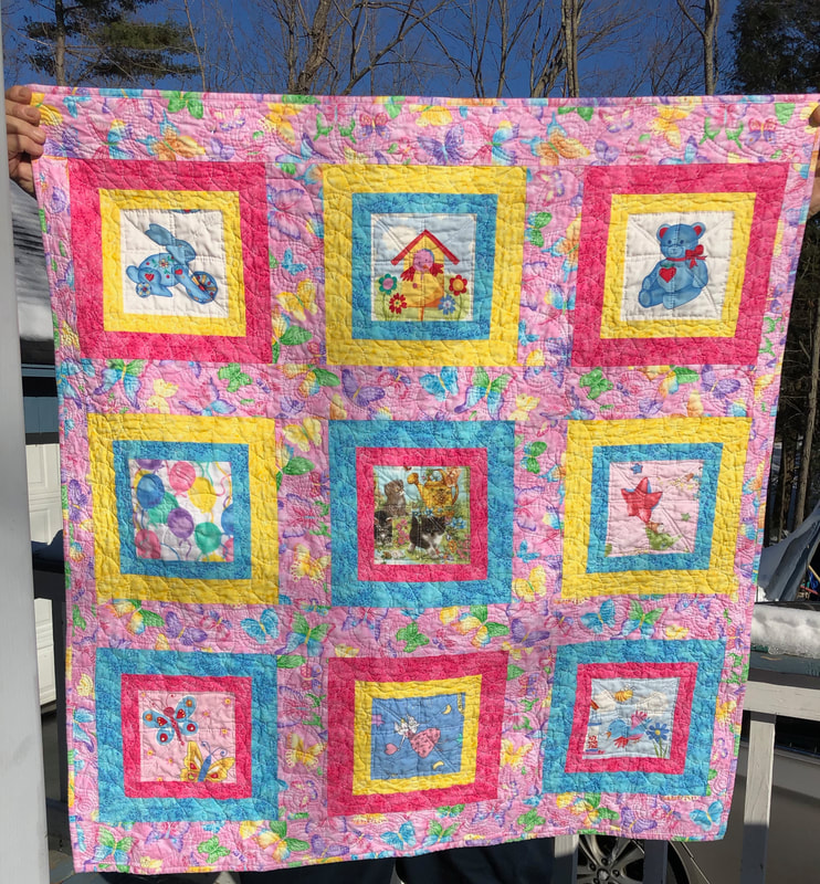 Baby Girl Quilt with a teddy bear, kittens, rabbit and more, for sale from HomeSewnByCarolyn.