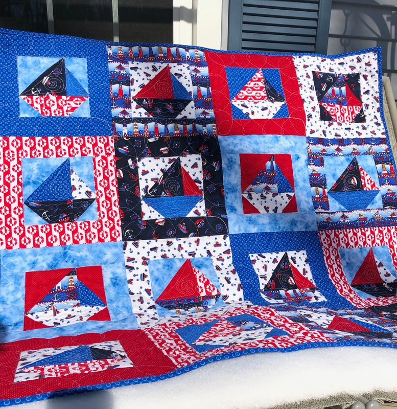 Red, White and Blue Sailboat  Handmade Baby Quilt for sale from http://www.HomeSewnByCarolyn.com/baby-quilts.html