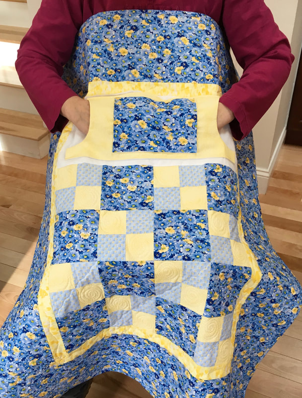 Blue and Yellow Floral Lovie Lap Quilt with Pockets for sale from http://www.HomeSewnByCarolyn.com 