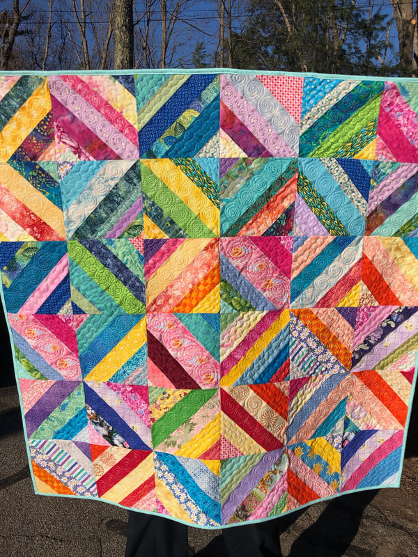 Scrap Baby Quilt for sale from http://www.HomeSewnByCarolyn.com 
