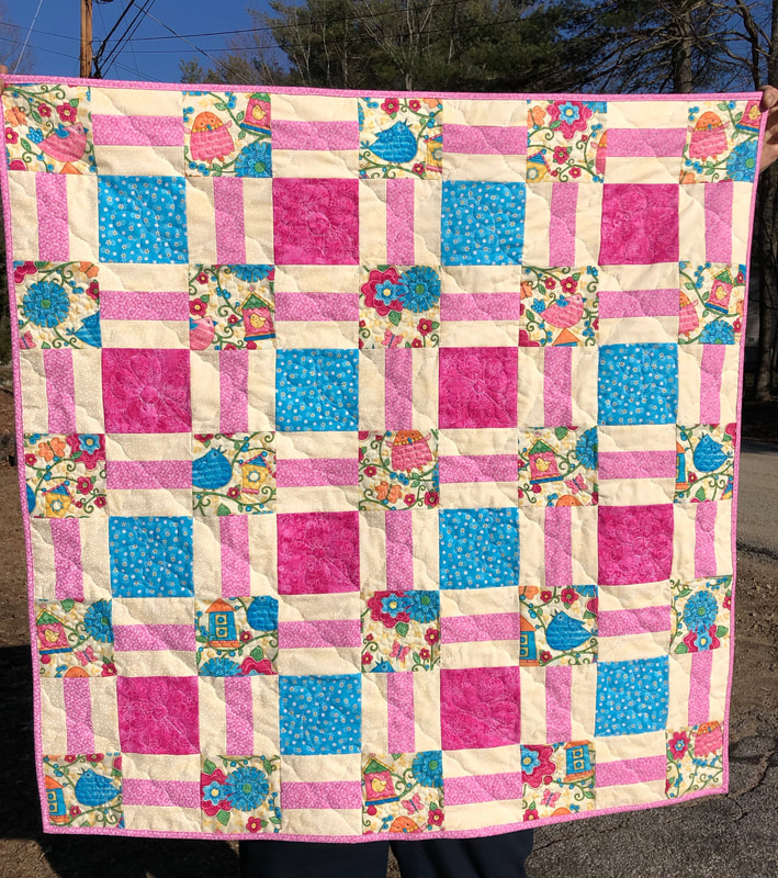 Pink and Turquoise Baby Quilt with birds, birdhouses and flowers.