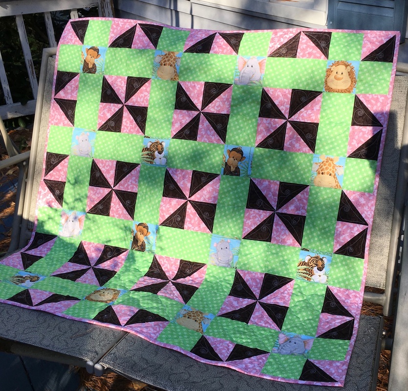 Pink, Brown & Green Animal Baby Quilt from http://www.HomeSewnByCarolyn.com