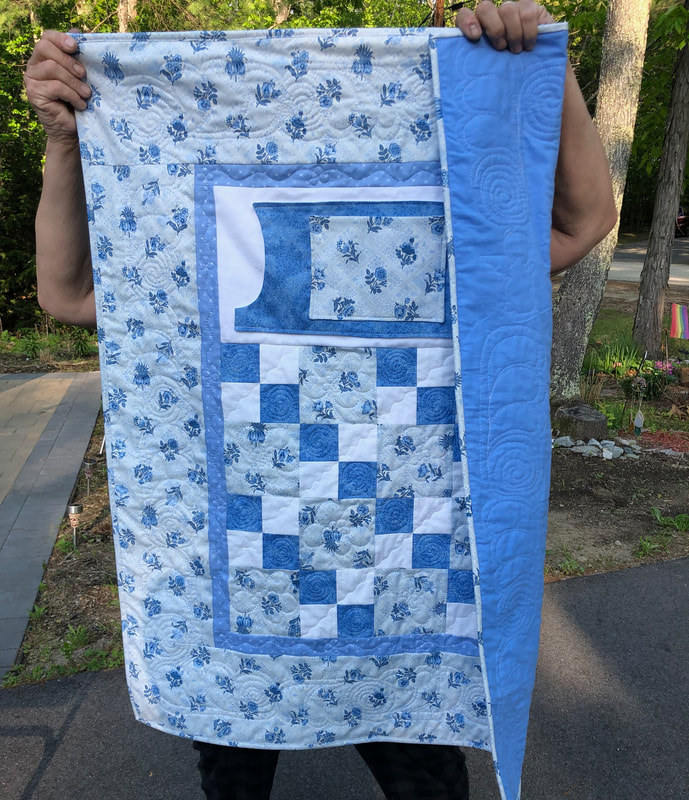 Blue And White Lovie Lap Quilt with Pockets and flannel backing