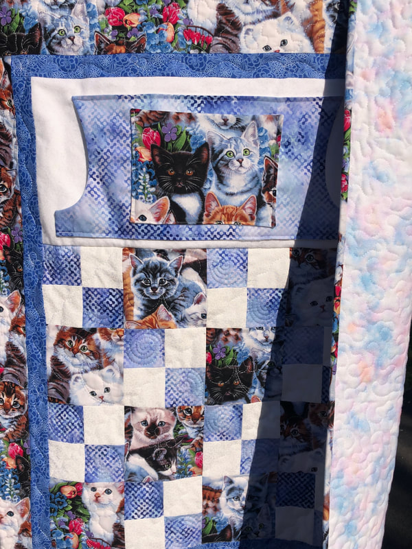 Adorable Kittens Lovie Lap Quilt with Pockets and flannel backing. 