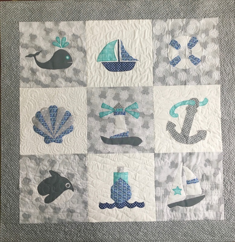 Nautical baby quilt by http://www.HomeSewnByCarolyn.com