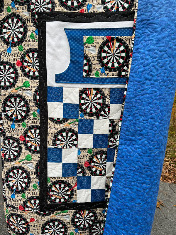 Dart board on lap quilt  with pockets for men