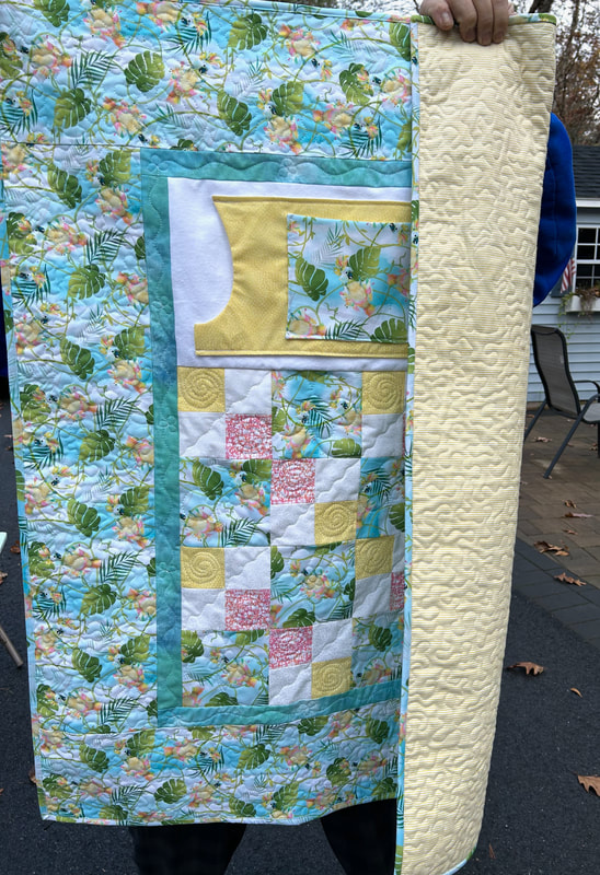 Lap quilt with pockets and flannel backing